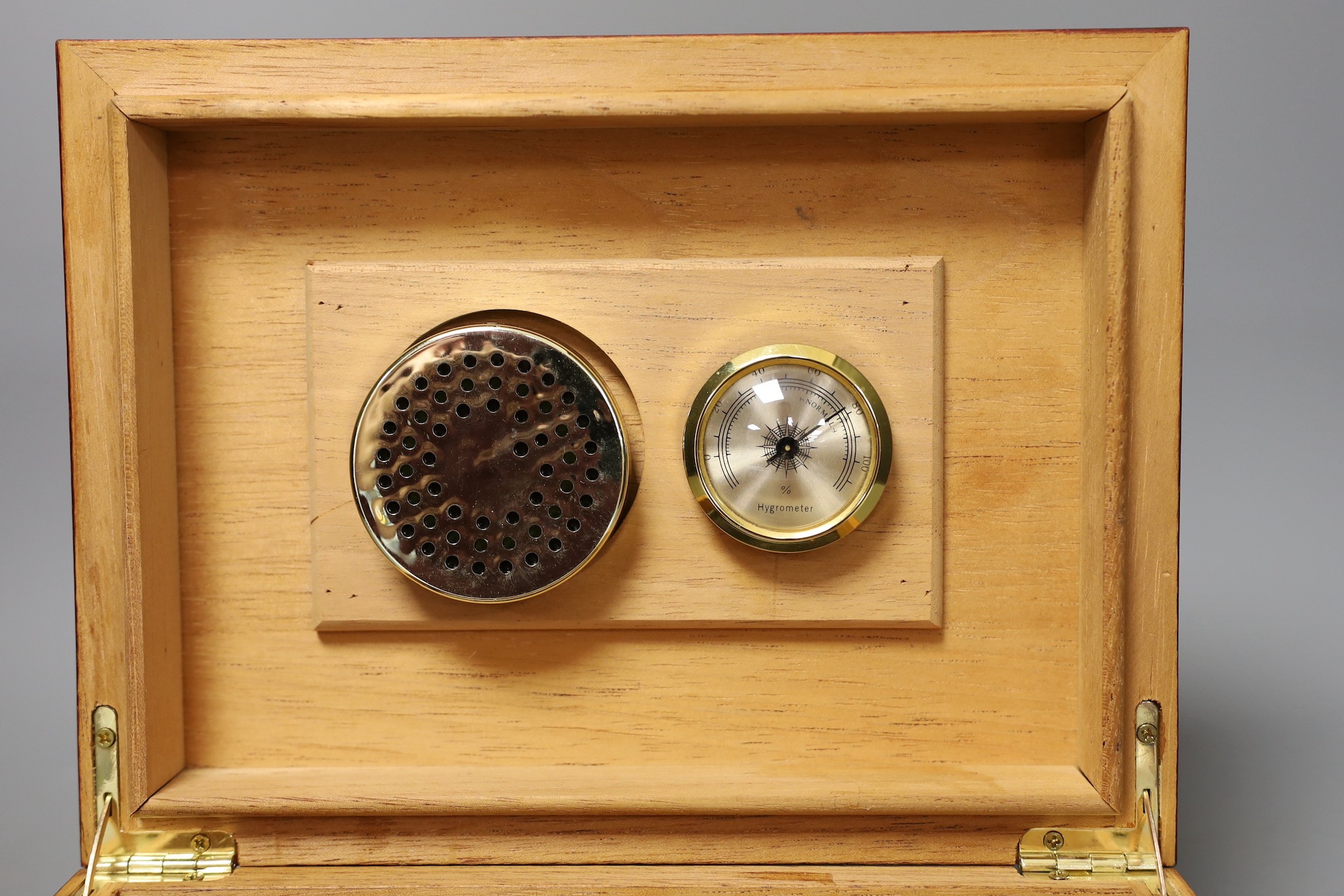 A mahogany humidifer and Dunhill leather cigar case